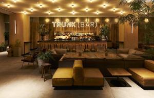 a lobby with a bar with couches and a bar at TRUNK (HOTEL) in Tokyo