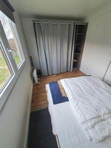 Postel nebo postele na pokoji v ubytování Resort Marina Suchacz