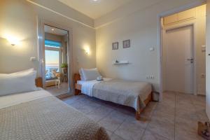 Posteľ alebo postele v izbe v ubytovaní Filia's Stunning Sea View Apartment