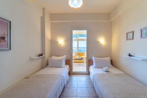 Posteľ alebo postele v izbe v ubytovaní Filia's Stunning Sea View Apartment