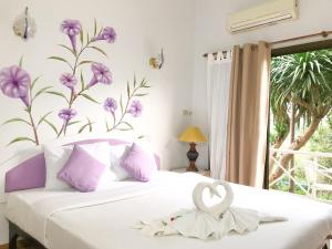 Ένα ή περισσότερα κρεβάτια σε δωμάτιο στο Phurua Bussaba Resort & Spa