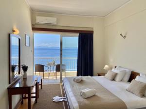 Postel nebo postele na pokoji v ubytování Hotel Cokkinis