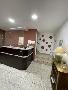 a large room with a large tub in the middle of a room at H Arkanta in Arganda del Rey