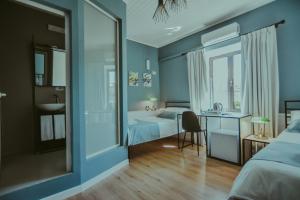Łóżko lub łóżka w pokoju w obiekcie Atelier Boutique Hotel