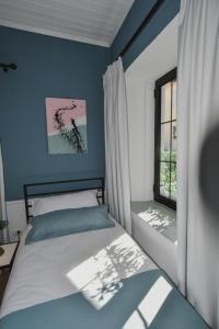 Łóżko lub łóżka w pokoju w obiekcie Atelier Boutique Hotel