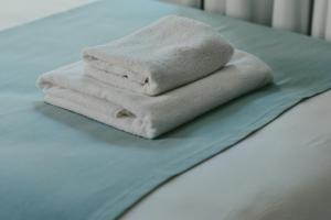 Łóżko lub łóżka w pokoju w obiekcie Atelier Boutique Hotel