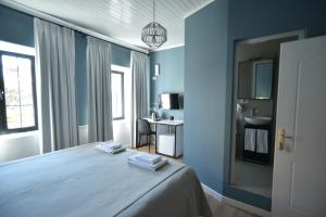 Łóżko lub łóżka w pokoju w obiekcie Atelier Boutique Hotel