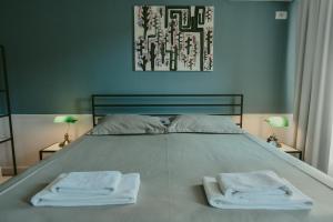 Łóżko lub łóżka w pokoju w obiekcie Atelier Boutique Hotel
