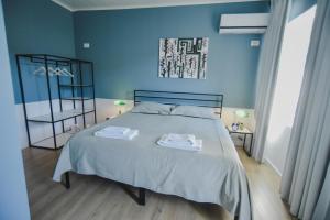 Łóżko lub łóżka w pokoju w obiekcie Atelier Boutique Hotel