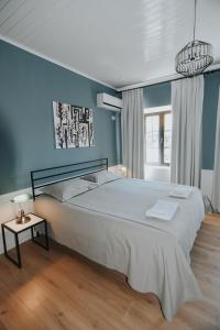 Łóżko lub łóżka w pokoju w obiekcie Atelier Boutique Hotel