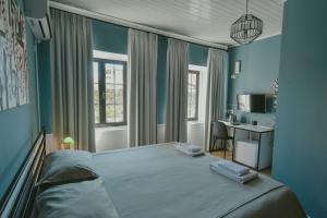 Łóżko lub łóżka w pokoju w obiekcie Atelier Boutique Hotel