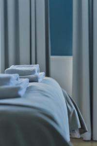 Łóżko lub łóżka w pokoju w obiekcie Atelier Boutique Hotel