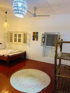 a room with two bunk beds and a rug at Zava House Stone town in Zanzibar City