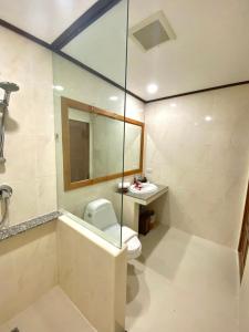 a bathroom with a toilet and a sink at Smile House - Fisherman Village in Bophut