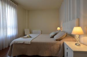 Ένα ή περισσότερα κρεβάτια σε δωμάτιο στο FLATSELECT Decanelas