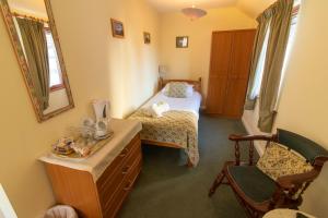 Voodi või voodid majutusasutuse Auld Cross Keys Inn toas