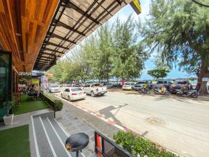 a view of a parking lot with cars parked at Irin Beach Cha-am in Cha Am