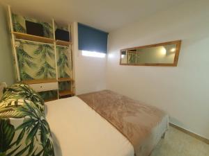 Tempat tidur dalam kamar di Vivienda Vacacional Hábitat Tropical