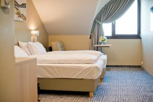 Hotel Molo Resort客房内的一张或多张床位
