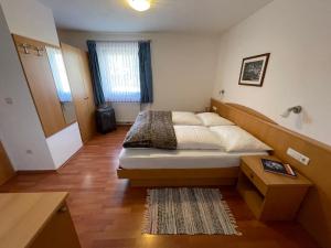 Un pat sau paturi într-o cameră la Appartamenti Hetty