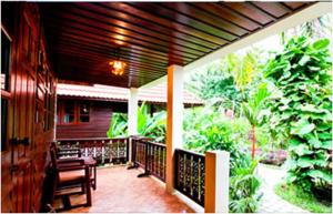 a porch of a house with a wooden deck at Smile House - Fisherman Village in Bophut