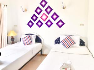 Postel nebo postele na pokoji v ubytování Phurua Bussaba Resort & Spa