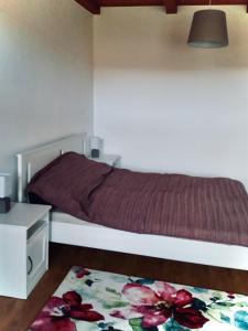 Ένα ή περισσότερα κρεβάτια σε δωμάτιο στο Apartman Lavendel