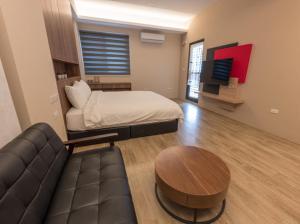 Rúm í herbergi á Yujing B&B 2