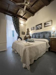 a bedroom with a large bed and a ceiling at Unico in Monterosso al Mare