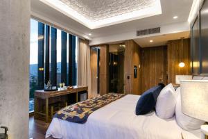 Voodi või voodid majutusasutuse Hotel Marquee Medellín toas
