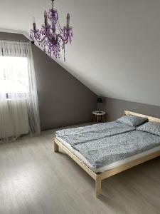 Ένα ή περισσότερα κρεβάτια σε δωμάτιο στο Kékesnarancs Vendégház