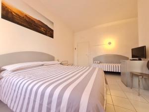 Postel nebo postele na pokoji v ubytování Hotel Da Graziano