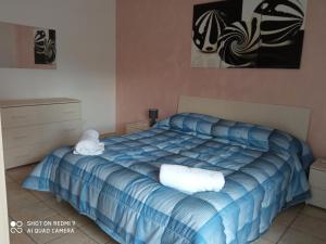 Katil atau katil-katil dalam bilik di Casa vacanze Nena