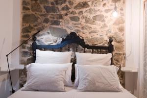 Postel nebo postele na pokoji v ubytování L'Hostatgeria del Celler