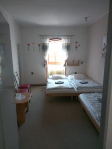 Postel nebo postele na pokoji v ubytování Penzion s restaurací "U MLYNA COM"