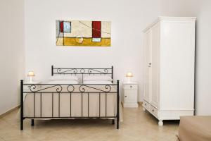 A bed or beds in a room at Terra D'Otranto