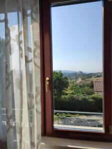 a window with a view of the countryside at Al dolce dormire in San Marco dei Cavoti