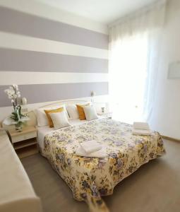 Postel nebo postele na pokoji v ubytování Hotel Cristoforo Colombo