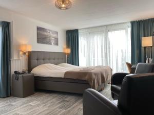 Postel nebo postele na pokoji v ubytování Hotel Cafe Restaurant Duinzicht