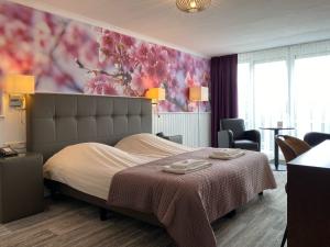 Postel nebo postele na pokoji v ubytování Hotel Cafe Restaurant Duinzicht