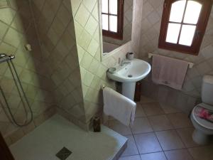 a bathroom with a sink and a toilet and a shower at Paradise in Peille