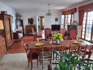 a living room with a table and chairs at Soutariba in Roquebrune-Cap-Martin
