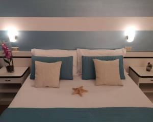 Ліжко або ліжка в номері Hotel Cristoforo Colombo