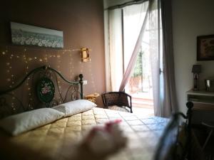 A bed or beds in a room at BELLA PALERMO