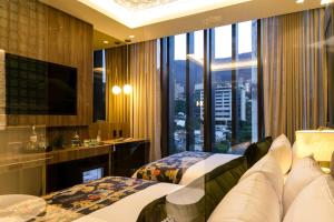 Televiisor ja/või meelelahutuskeskus majutusasutuses Hotel Marquee Medellín