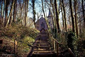 a set of stairs leading to an old church at Gite Le Minile in Béthencourt-sur-Mer