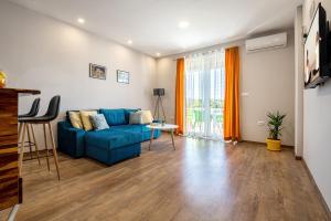 TV a/nebo společenská místnost v ubytování Apartments Leona