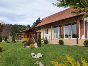 a house with a yard in front of it at Dolce Vita House Vrdnik in Vrdnik