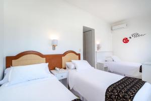 Postel nebo postele na pokoji v ubytování Hotel Romimar 3* Sup