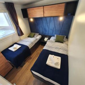 Posteľ alebo postele v izbe v ubytovaní BIOGRAD MOBILE HOME OASIS